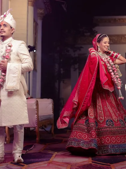 A fun, candid moment after the ceremony, with the bride twirling her lehenga.