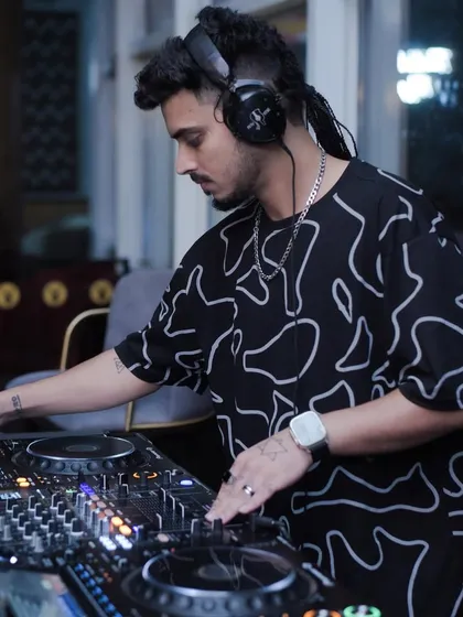 Deep in the groove, selecting the perfect next track for the dance floor at Playboy. Every song is a deliberate choice to keep the energy flowing.