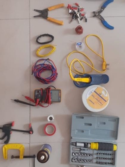 A layout of the essential tools for an electronics repair workshop. We teach kids to identify and use the right tool for the job, from multimeters and soldering irons to wire strippers and screwdrivers.