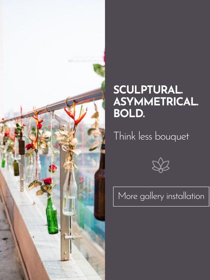 Think less bouquet, more gallery installation. This sculptural design uses recycled bottles and single stems to create an artistic and modern statement, proving that powerful design can be both sustainable and beautiful.