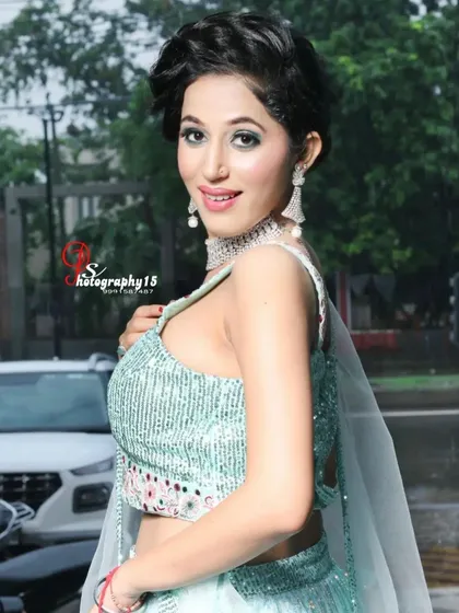 Another angle of the sea-green lehenga, showing the sparkle of the blouse. This rental is perfect for a daytime event or a summer evening party.