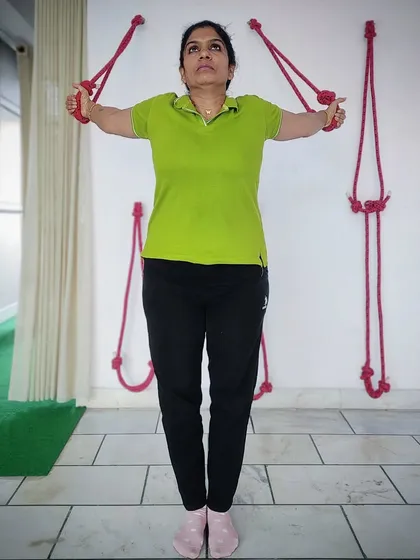 We use wall ropes, an Iyengar yoga specialty, to help students with shoulder and chest opening. This technique is particularly effective for correcting posture and relieving upper back and cervical tension.