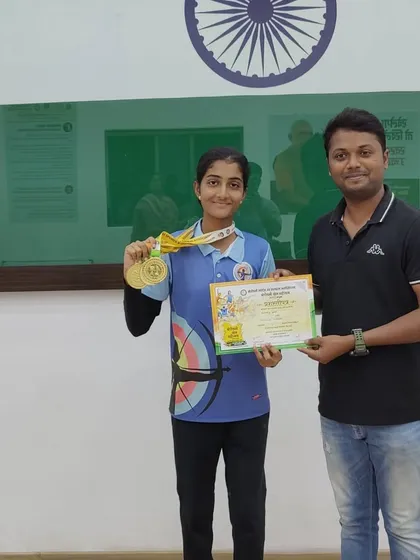 Presenting a certificate and medals to another one of our champions from the Borivali Krida Mahotsava.