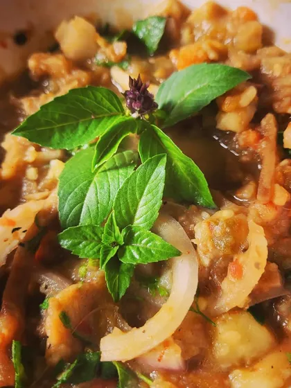 This is Eromba, a popular and healthy delicacy from Manipur. It's a flavourful mash of boiled vegetables, potato, and fermented fish, spiced with King Chilly and garnished with fresh basil.
