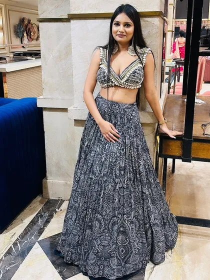 A client looking absolutely stunning in a modern printed lehenga with a pearl-embellished blouse. A perfect look for a cocktail or sangeet.