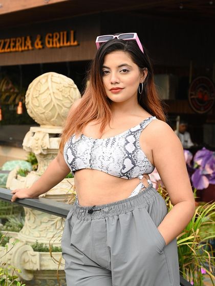 A classic influencer-style pose, perfect for showcasing an outfit of the day.