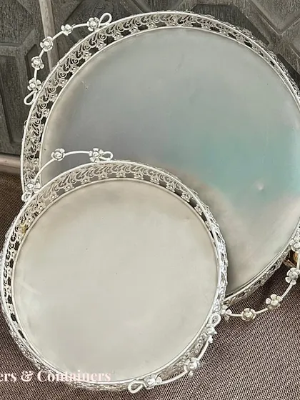 This set of two silver-finish platters is a classic choice for festive serving. The delicate floral cutout on the handles adds a touch of elegance.