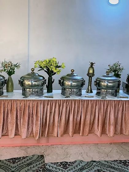 A charming and graceful buffet arrangement for a celebration of 80 guests in Vasant Vihar. The soft color palette and floral details created a wonderfully elegant atmosphere.