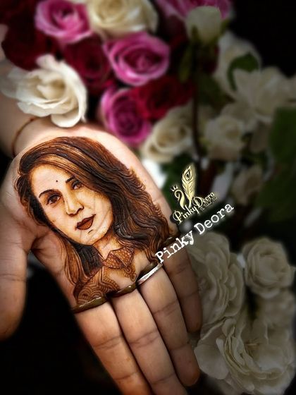 A portrait of the soulful singer Kinjal Dave. Capturing the likeness of a real person in mehndi is a challenging yet rewarding skill that sets an artist apart.