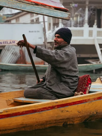For me, travel is about the people and their stories. This moment on Dal Lake, capturing a local boatman in his element, is what makes a destination film feel authentic and alive.