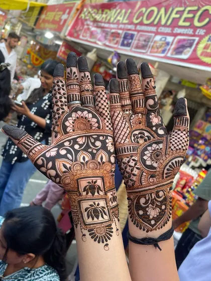 The same design captured in a bustling market setting, showing the artwork in a different light.