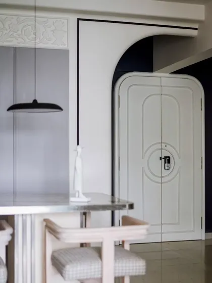 The arched detailing in the entrance passage sets a grand and sophisticated tone for the entire home. It's a commanding presence that immediately signals a departure from the ordinary.