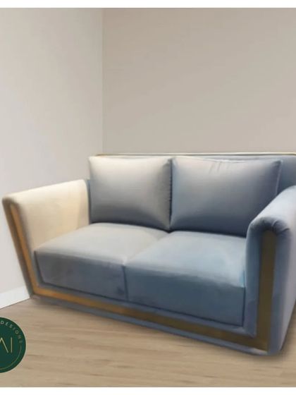 A modern loveseat with a unique silhouette, featuring a two-tone design and a sleek frame. This piece is perfect for smaller spaces or as a complementary seat in a larger living room.