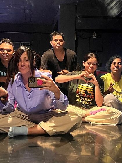 A happy, relaxed group photo of students after a class.