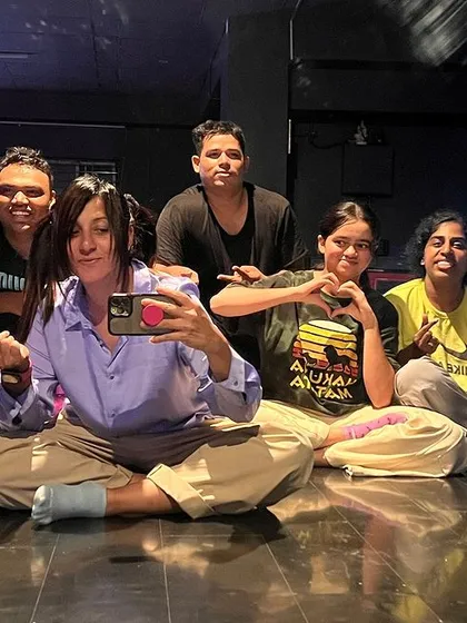A happy, relaxed group photo of students after a class.
