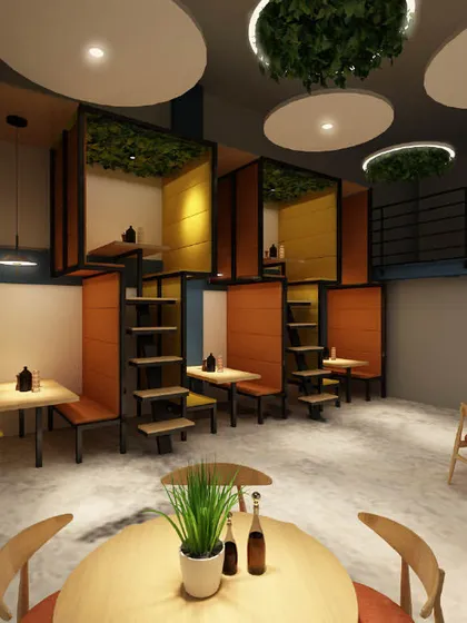 Another look at the cafeteria's pod seating, which offers a semi-private space for employees to relax or work. The design uses natural wood tones and pops of orange.