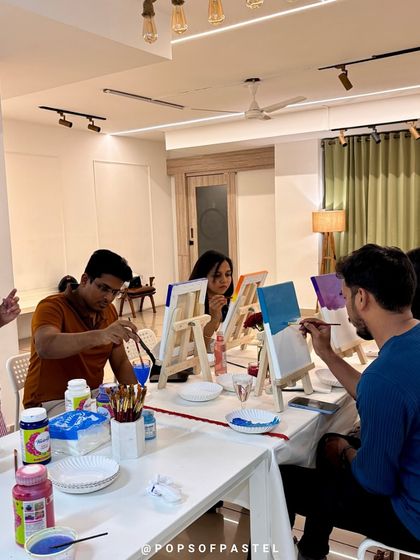 Our instructor guides couples through a sip-and-paint session, creating a relaxed and fun atmosphere for a Valentine's Day event.