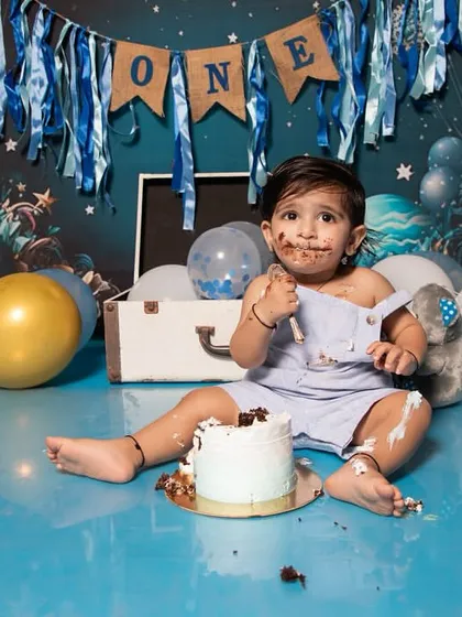 A cake smash session is all about capturing pure, unfiltered joy. This little one had the best time exploring his first birthday cake, and his messy, happy face is a perfect memory of this sweet milestone.