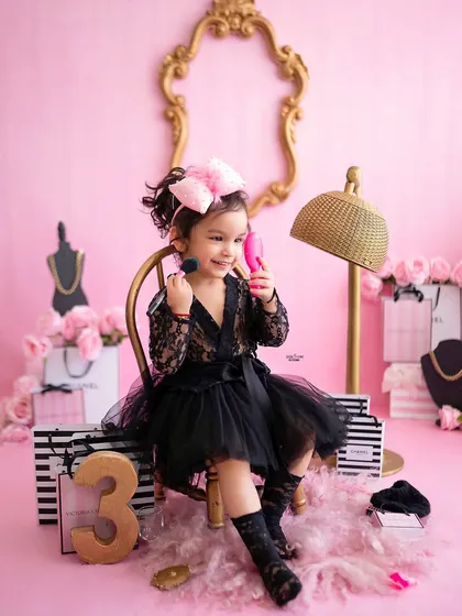 Who says photoshoots can't be glamorous? This little fashionista had a blast at her chic spa-themed session. From playing with makeup brushes to striking a pose, it was a fun and sassy day that perfectly captured her sparkling personality for her third birthday.
