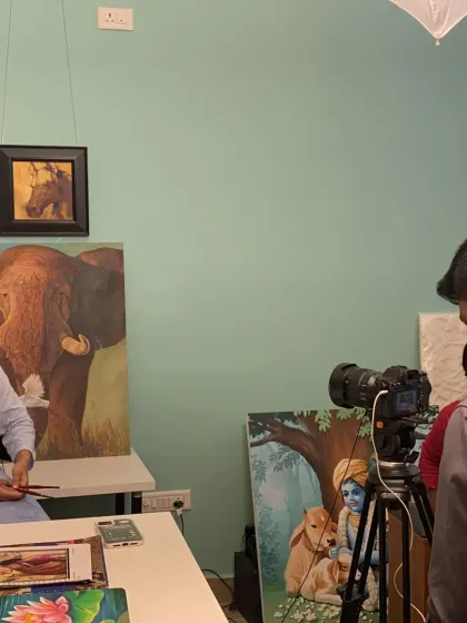 We focus on your individual growth. This moment from a portfolio shoot in the studio shows our commitment to preparing you for professional opportunities, whether it's for exhibitions or certifications.