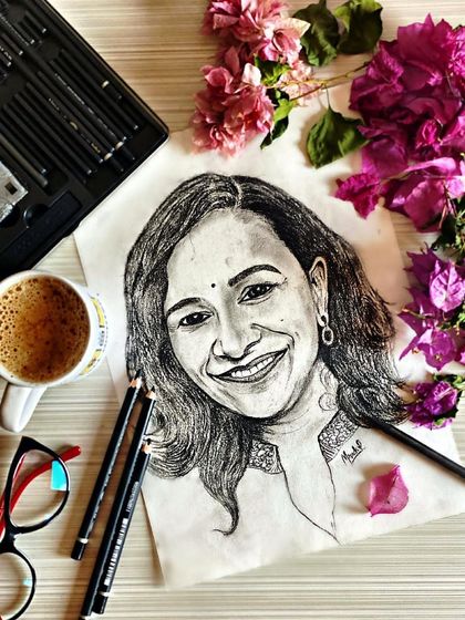 A portrait sketch surrounded by the tools of my trade. This piece shows how a simple pencil drawing can capture a bright and warm personality.