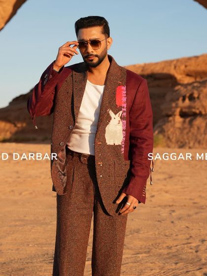 A closer look at Zaid Darbar in the Phantasm Suit. The rabbit motif and color-blocked sleeves add a whimsical yet sophisticated element to the tailored ensemble.