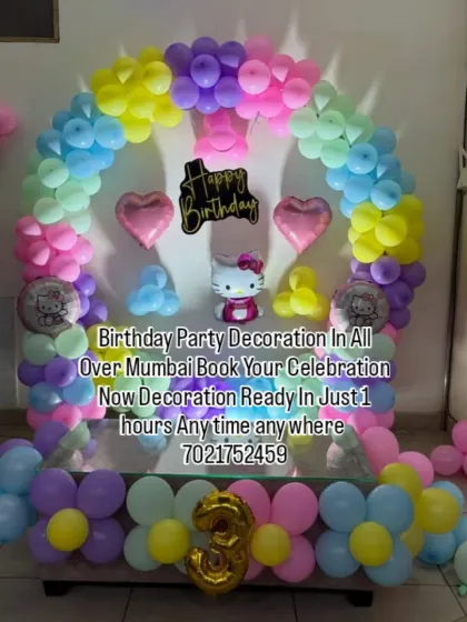 A sweet Hello Kitty theme for a 3rd birthday party. This decoration includes a pastel balloon arch, Hello Kitty foil balloons, and heart-shaped accents, all set up neatly at home.