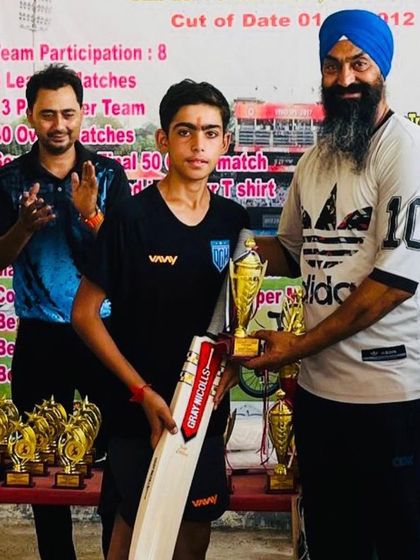 Shubham receiving his Best Batsman trophy. A well-deserved award.