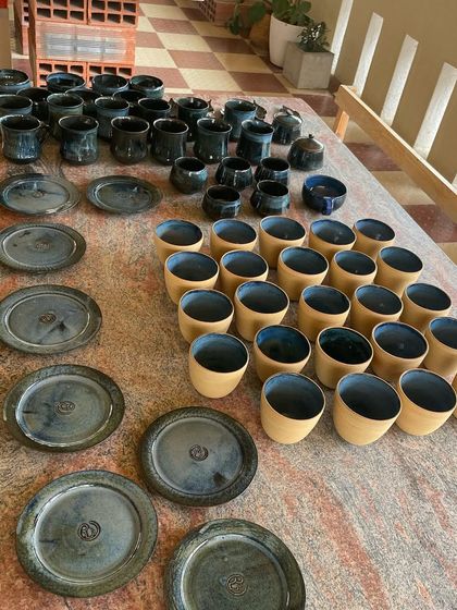 I love the beautiful imperfections that can happen during firing. This batch of stoneware cups and plates came out with a stunning, deep blue glaze that has so much character.