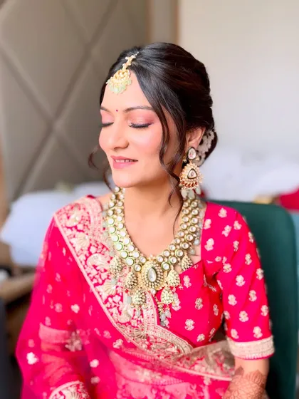 A happy, smiling bride. Her makeup is light and airy, letting her natural joy shine through while still looking perfectly polished.