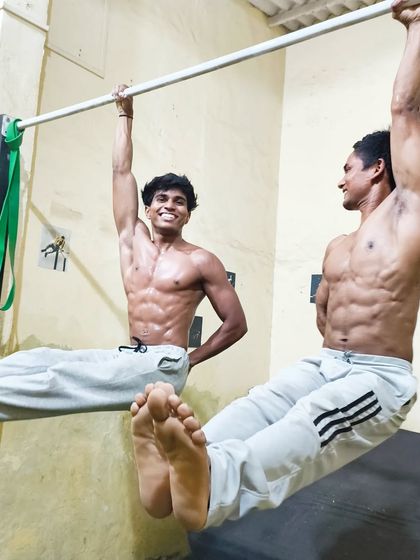 Combining skills like the one-arm hang and L-sit. This shows the versatility and strength that calisthenics develops.