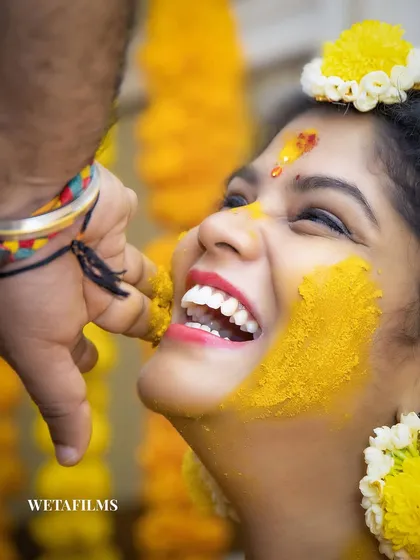 The pure, uninhibited laughter of a Haldi ceremony. We believe the best moments are unposed. Our goal is to make you feel so comfortable that you forget we are there, allowing us to capture genuine expressions of joy like this one.