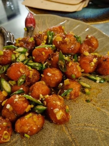 Crispy on the outside and soft on the inside, our Honey Sesame Potatoes are a crowd-favourite appetizer. These bite-sized potatoes are tossed in a sweet and sticky sauce with a hint of spice.