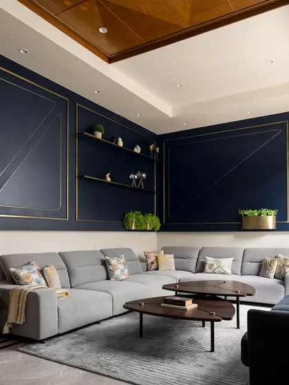 Another perspective of the Prata House living room, showcasing the interplay of materials. The warmth of the diagonal wood panelling contrasts beautifully with the bold, elegant blue feature wall, embodying modern, dynamic design.