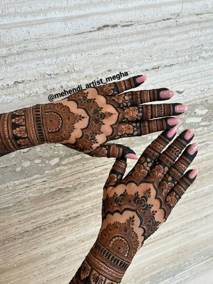 The back of the hands for the engagement design, featuring delicate floral patterns that complete the bridal look from every angle.