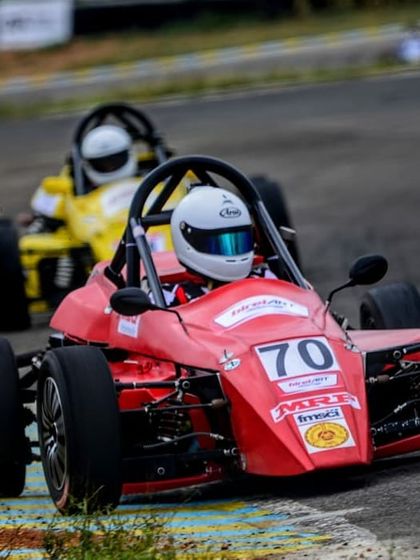 Our driver in the number 70 car, being pursued by a competitor, showcasing the close racing in the Formula LGB series.