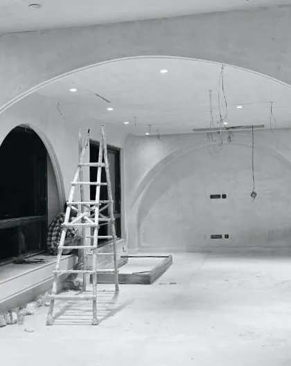 An interior space under construction where we are experimenting with arched forms. The raw plaster and exposed wiring show the space in its most elemental state.