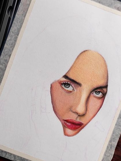 An angled view of the Billie Eilish WIP, showing my art supplies.