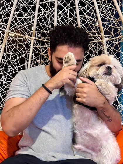 This is the kind of love we see every day. A quiet moment of connection between a pet parent and his best friend is what makes our cafe more than just a place; it's a home for dog lovers.