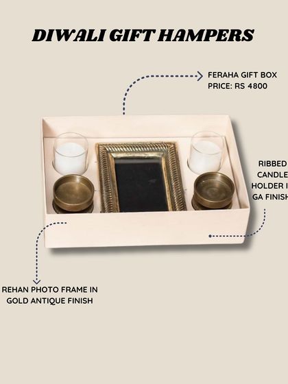 Simple and elegant, the Feraha Gift Box includes a gold antique finish photo frame and two ribbed candle holders, making it a timeless Diwali present.