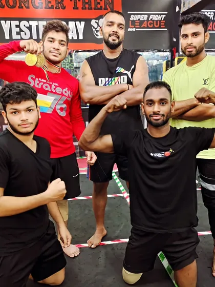 Champions are made, not born. Posing with some of my medal-winning fighters.