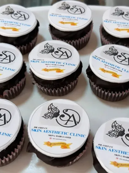 Branded cupcakes are a great way to share a sweet treat at company events. Here, I've topped chocolate cupcakes with crisp, edible discs featuring the logo for a skin aesthetic clinic, ensuring perfect brand representation in every bite.