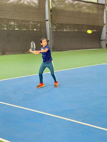 A young athlete executes a forehand with precision during a UTR event at our academy. We train our players to perform under the pressure of a real match.