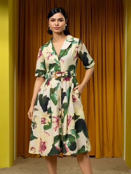 A classic lookbook shot for Boho-Chic, featuring a belted dress against the studio's custom set.