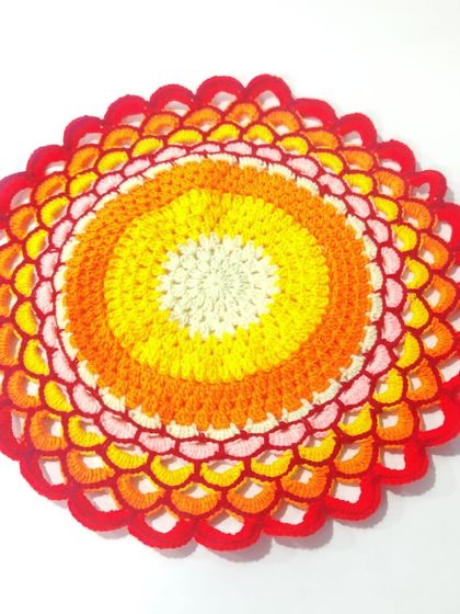 The full 15-inch sunset doily. The colors are chosen to create a beautiful, warm gradient that brightens any surface.