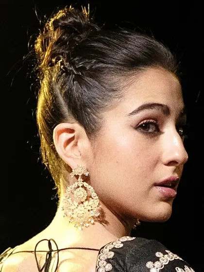 A closer look at the handcrafted Chandbali earrings, as worn by Sara Ali Khan. These earrings are made from 18k gold and feature intricate filigree work, natural diamonds, and delicate pearl drops, designed to be surprisingly lightweight.
