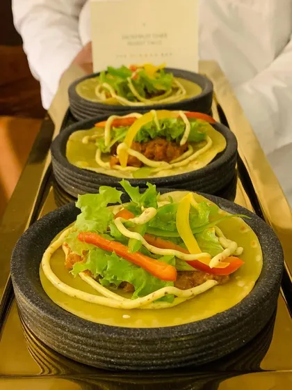 Our inventive Butter Chicken Tacos, another example of our playful and delicious approach to modern Indian fusion cuisine.