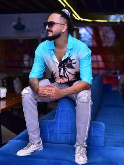 A relaxed pose during a photoshoot.