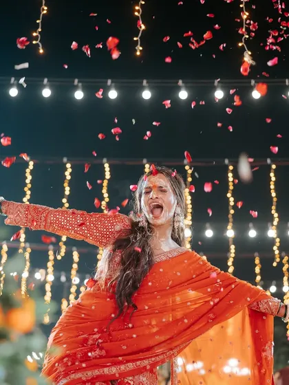 Pure, uninhibited joy! This bride's ecstatic expression during her Haldi ceremony is exactly the kind of moment we live to create.