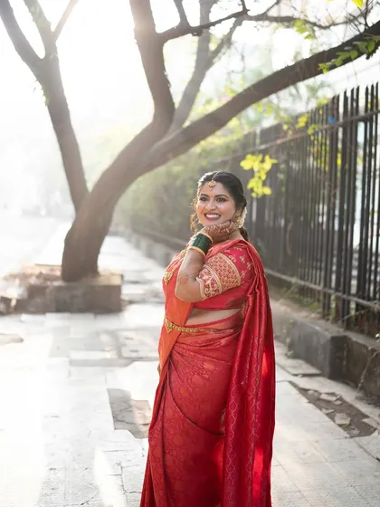 A side profile of the bride, capturing her grace and the elegance of her attire.